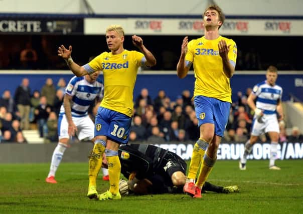 Ezgjan Alioski and Patrick Bamford rue a missed chance for Leeds United at Queens Park Rangers. Picture: Bruce Rollinson