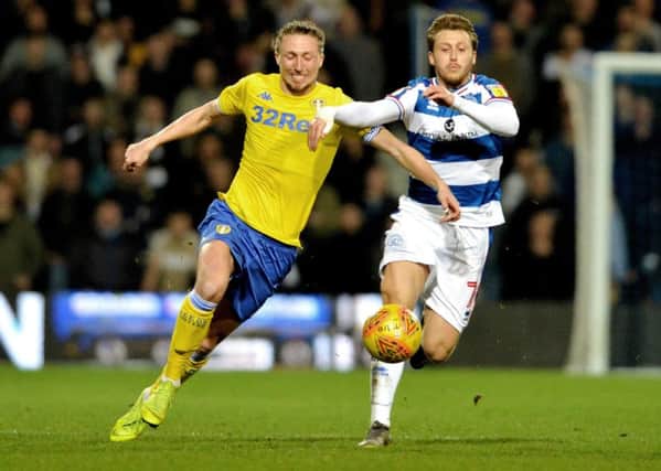 Luke Ayling chases after the ball with Luke Freeman in Leeds United's defeat at QPR.  Picture: Bruce Rollinson