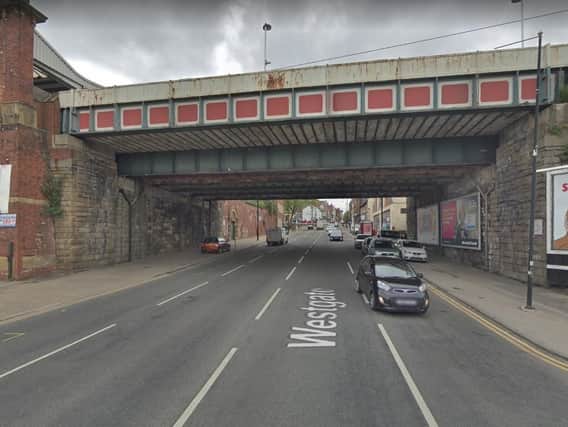 Westgate in Wakefield has been closed after a woman was seriously injured in a collision.