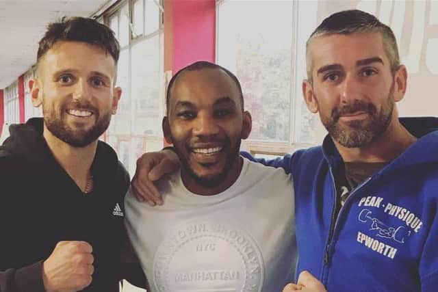 Dom Hunt (left) with trainer Junior Witter (centre) and fellow fighter Chris Dutton (right).