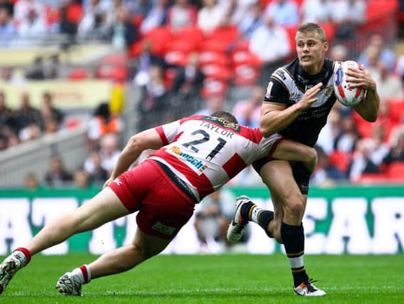 Jacob Miller tries to go past Wigan Warriors' Scott Taylor when playing for Hull FC in the 2013 Challenge Cup final. (SWPix)