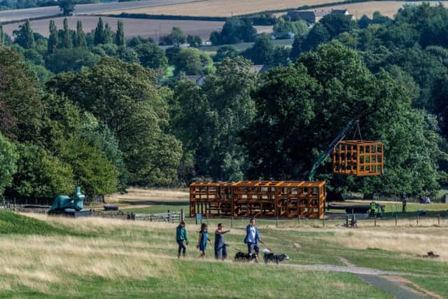 Date: 29th August 2018.
Picture James Hardisty.
The installation of a new exhibit at the Yorkshire Sculpture Park, West Bretton, Wakefield. A large crane has been used to carefully positions sections of Crate of Air (2018), a 3.6m x 19.2m x 7.2m welded steel sculpture by Irish-born artist Sean Scully, ahead of his major YSP exhibition Inside Outside, which opens on 29 September 2018.