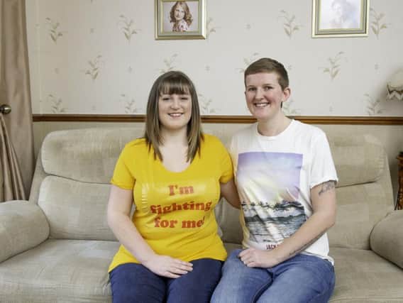 Rebecca Marcon, pictured with her wife Emily, wants to raise awareness of endometriosis.