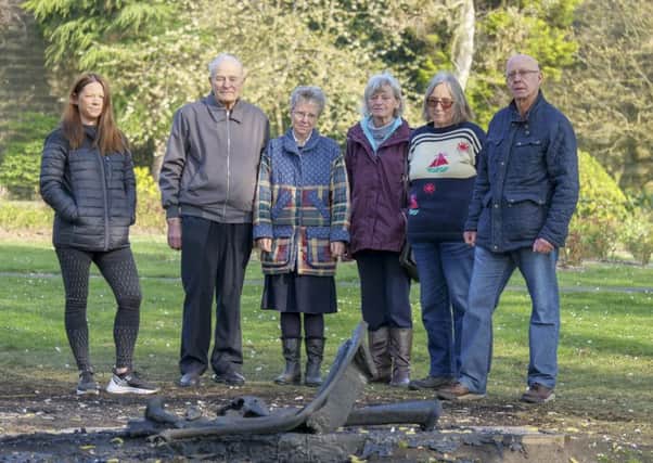Up in flames: Rachel Riley with members of the Friends of Friarwood Valley Gardens, who funded the installation of the bench two years ago.