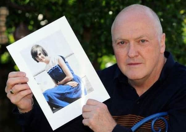 Colin Frost holds a photo of his sister Elsie, who was murdered at the age of 14. Pic: Scott Merrylees