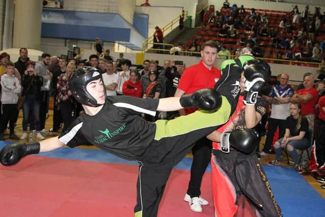 Bailey Willis lands a head kick in one of his kickboxing contests at the National Championships.