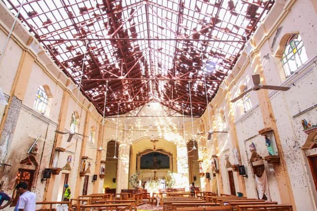 Sri Lankan officials inspect St Sebastian's Church in Negombo, north of Colombo, after multiple explosions targeting churches and hotels on Easter Sunday.