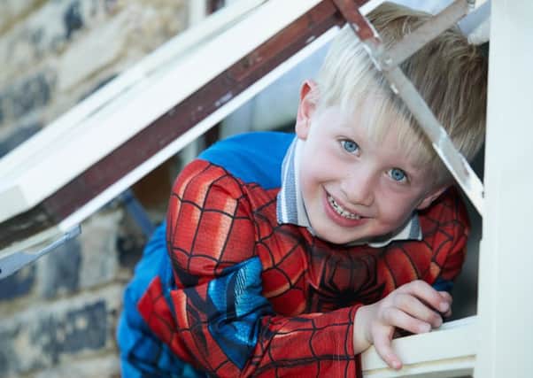 Young Isaac Barraclough crawled through the window of a house to open door after his aunty collapsed.