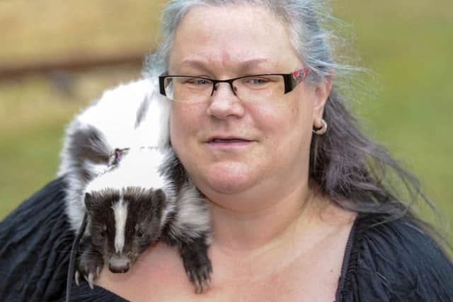 Paula Bavill and her support skunk Pongo. Picture Scott Merrylees