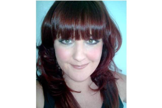 Pictured in 2009, Siobhan Phillips shows off a darker shade of her trademark red hair.