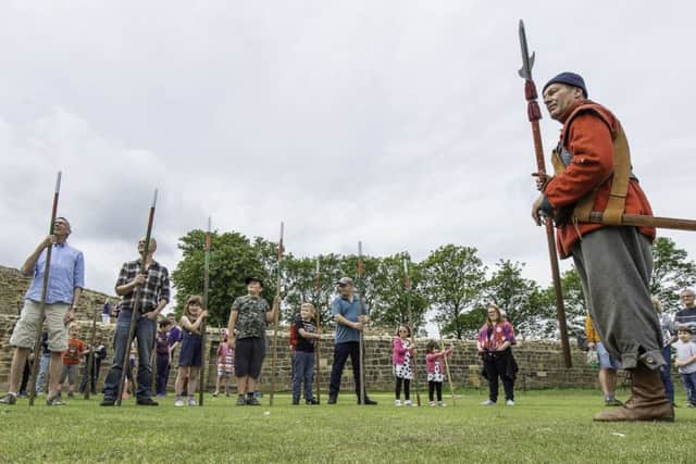 Picture by Allan McKenzie/YWNG - 01/06/19 - Press - Pontefract Castle Civil War Day, Pontefract, England - Youngsters & adults learn the ropes of civil war infantry days with relpica muskets.