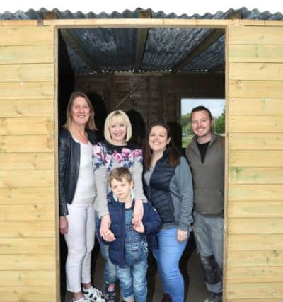 Hayley Edwards appealed for help after her stable were destroyed. Lots of people stepped forward and it is now complete.
Pictured are Hayley Edwards, Nathan Hudson, Kathryn Scott, Lisa Wells and Steven Wells