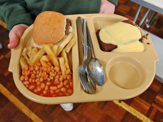 Lunch staff have been using food banks after pay problems.