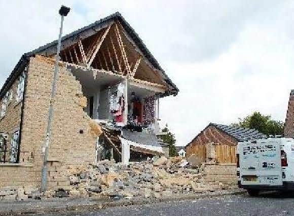 The house hit in the crash so was so badly damaged it is still being rebuilt.
