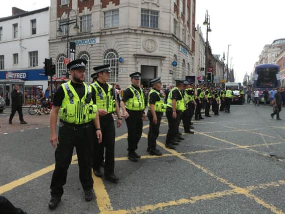 Police officers at a protest in Leeds city centre in 2018. Picture: SWNS