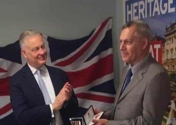 Richard being applauded on receiving his MBE by the British ambassador to Spain, Simon Manley.