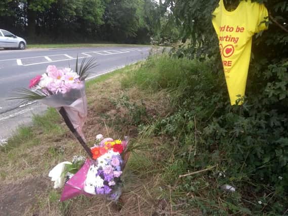 Tributes have been left at the site of a Pontefract crash which claimed the life of a taxi passenger.
