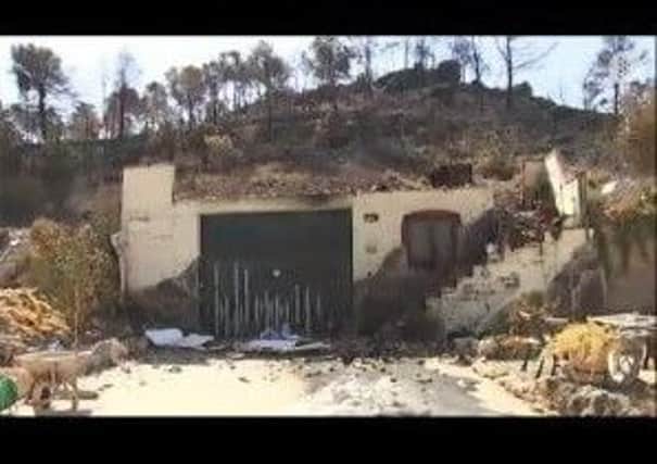 Damage: Alan Holts home was devastated in wildfires that swept through Catalonia.