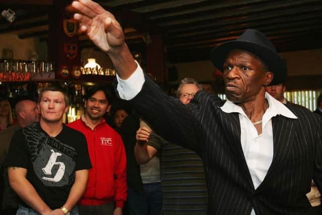 Floyd Mayweather Senior plays darts in a Manchester pub during his time as Ricky Hatton's (left) trainer. PIC: Matthew Lewis/Getty Images.