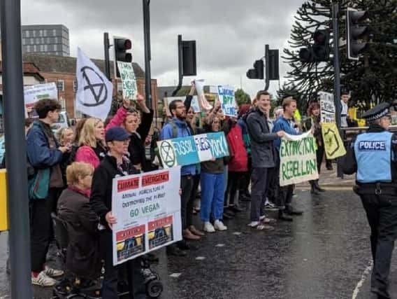 Extinction Rebellion protesters block traffic on the A61 in Leeds