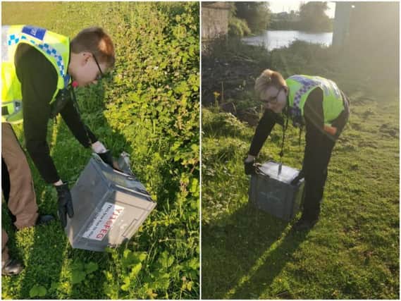 PCSOs Steve Dye and Jess Pick dealt with the snake before releasing it near the canal. Pictures: West Yorkshire Police