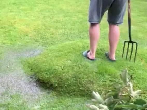 The blister appeared on the lawn in Ackworth after the recent torrential rain (Phot and video: Yvette McKinney /SWNS.COM).