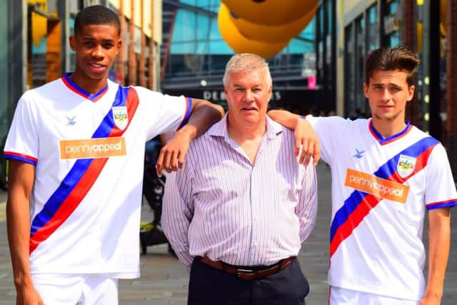 Chris Turner with two of the new Wakefield AFC players