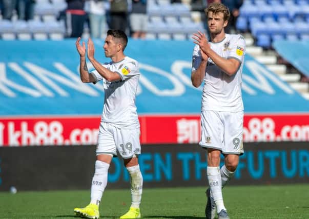 Pablo Hernandez and two-goal Patrick Bamford applaud the 5,000 travelling Leeds United fans at Wigan Athletic.