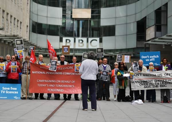 Senior citizens protest outside the BBC studios against the end of government funding for free TV licenses for the over 75s. (Getty Images)