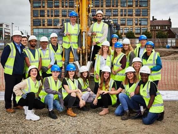 Work on a state-of-the-art performing arts facility for students of CAPA College has officially begun. Pictured are staff and students with contractors from Clugston Construction. Photo: David Lindsay