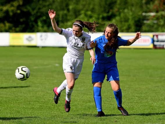 Leeds' Caitlin Gough battles for the ball in Sunday's match against Stockport County.
