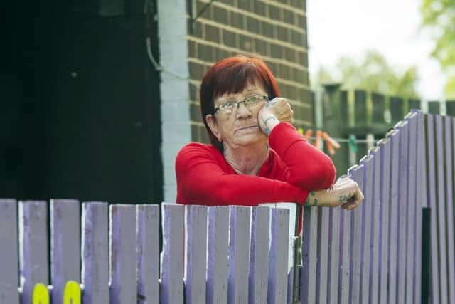 Bright idea?:  Vera Smallwood is at loggerheads with WDH over the paint job of her council bungalow fence, which they say is now too bright.