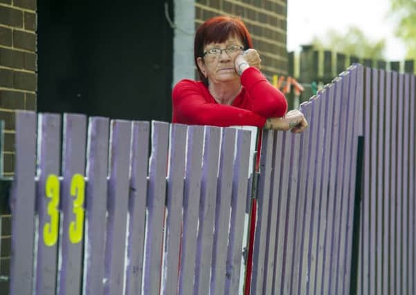 Vera Smallwood has been ordered by WDH to re-paint her fence after she painted it purple. Picture Scott Merrylees