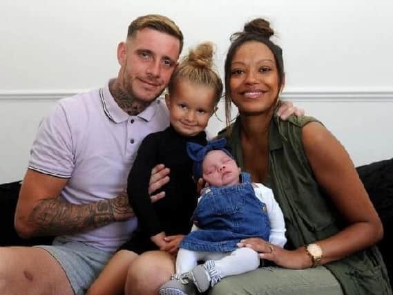 Little Mya Mae pictured with her mum Sharnelle Davis, partner Daniel Quigley and sister Anaiya-Rae aged 4, pictured at their home at Thorpe, East Ardsley. Picture by Simon Hulme.