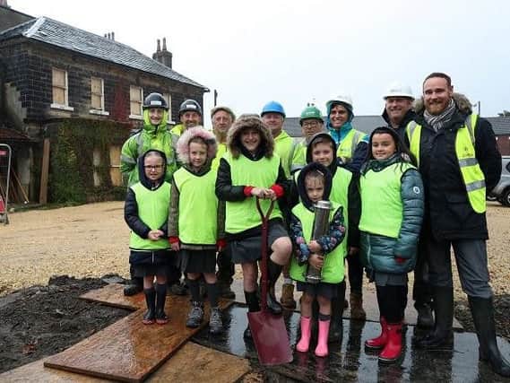 Pupils from Featherstone All Saints CofE Academy helped to bury a time capsule at Featherstone Hall