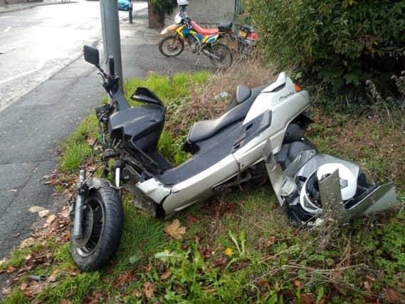 The moped was badly damaged in the smash.