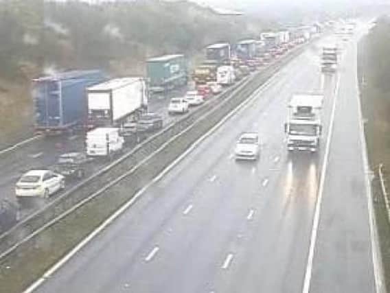 Delays on the M62 at Wakefield could last all day, West Yorkshire Police's roads unit has said.