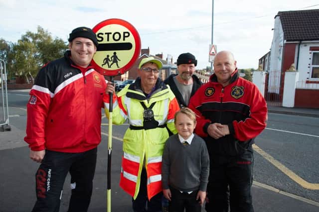 Pupils from the ET Martial Arts helped raise cash for a bodycam for the lollipop lady on Barnsley Road, Moorthorpe so they can catch people not stopping. Pictured are Carol Sykes (lollipop lady), Eamon Timmins, Mick Yound and David Picken from ET martial arts and a school pupil