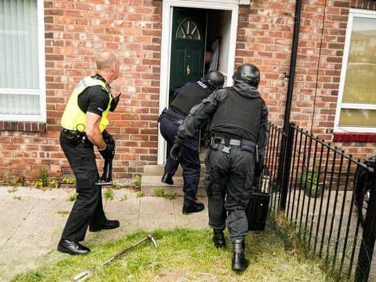 Drugs and weapons were found during the raids. (pic by WYP)