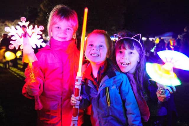 Visitors brought their lights, glow sticks and homemade lanterns to light up the night as they followed the parade through the town.