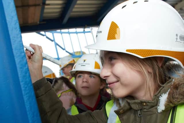 Primary school pupils have been gifted the chance to help shape the new Five Towns Leisure Centre - by signing their names onto its foundations.