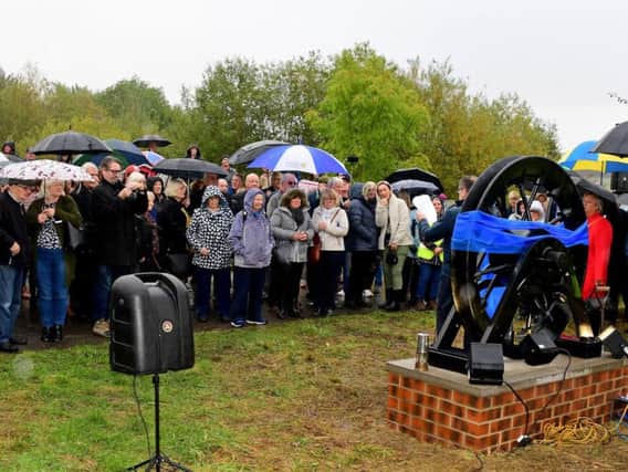 A pit wheel dedicated to those worked and died at a former mine was unveiled at Walton Colliery Nature Park at the weekend.