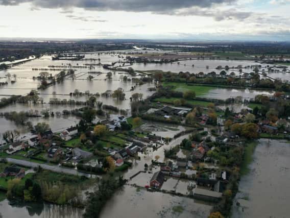 The view above the village of Fishwick, in South Yorkshire, after the River Don burst its banks with catastrophic consequences.