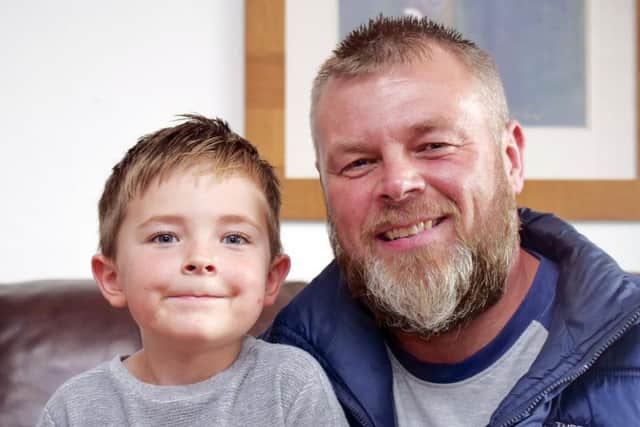 Charlie Batham has climbed a total of 19 mountains since he turned five in April, including Yorkshires Three Peaks.He is pictured with dad Paul Batham.