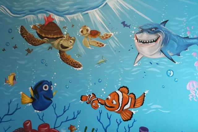 She designs and paints all freehand. Her custom style walls are always in popular demand, particularly her Disney ones.
