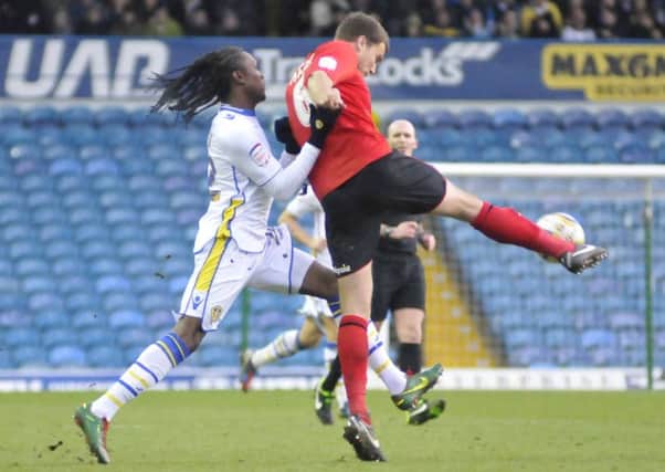 Debutant Habib Habibou battles for the ball with defender Ben Turner for Leeds United against Cardiff. Picture: IAN HARBER