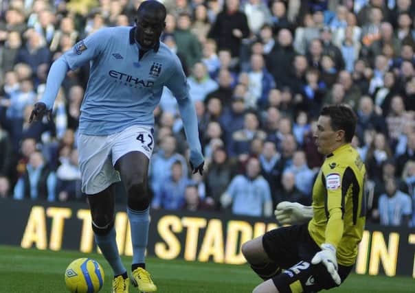 Yaya Toure rounds Jamie Ashdown for Manchester City's first goal against Leeds United. Picture: IAN HARBER