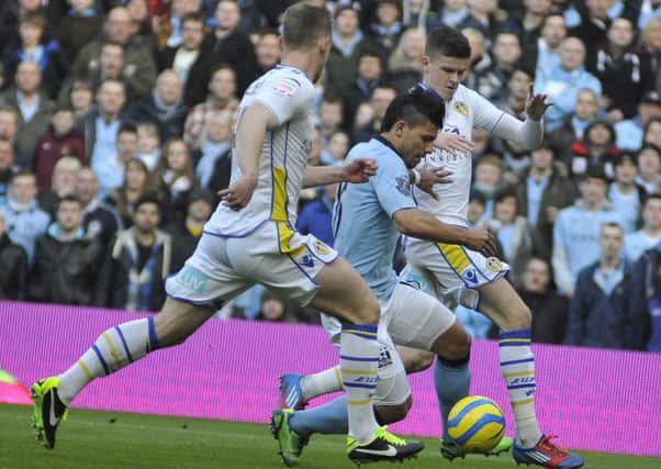 Sergio Aguero takes on Leeds United defenders Tom Lees and Sam Byram during last Sunday's FA Cup tie. The Whites defenders will be hoping for an easier ride against Blackpool. Picture: IAN HARBER