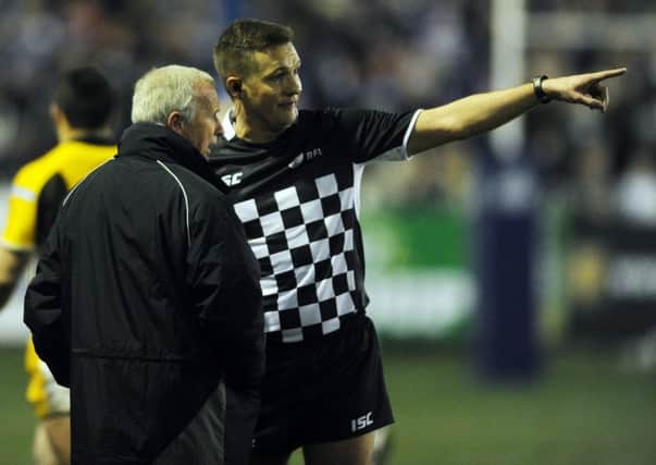 Referee Ben Thaler points out a problem to a RFL official during Castleford Tigers' game against Wakefield.