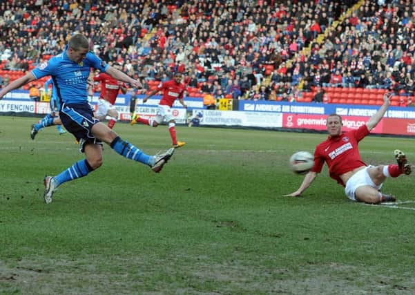 Steve Morison gets in a shot to hit the post for Leeds United at Charlton.